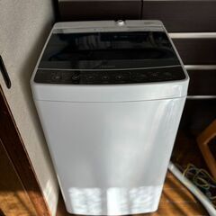 縦型洗濯機と電子レンジ