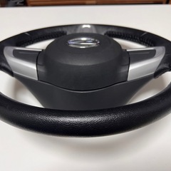 値下げ！ダイハツ純正革ハンドル黒中身入りの画像