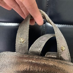 ANNA SUI 星型装飾 メタリックリュックの画像