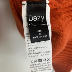 オレンジニットの画像