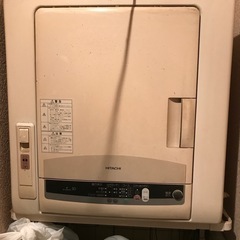 古い衣類乾燥機と台