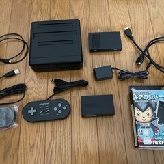 レトロフリーク(ブラック) + ギアコンバータ + ファミコンカセットの画像
