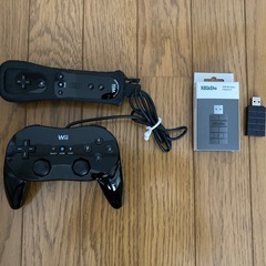 レトロフリーク(ブラック) + ギアコンバータ + ファミコンカセットの画像