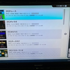 レトロフリーク(ブラック) + ギアコンバータ + ファミコンカセットの画像