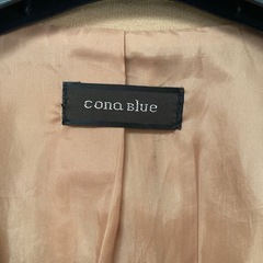cona blue ベージュ テーラードジャケットの画像