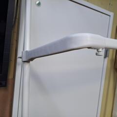 突っ張り洗濯機上部物置の画像