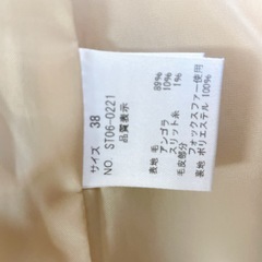 ファー付きフードのロングコートの画像