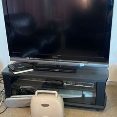 Sony TV with remote and TV Console