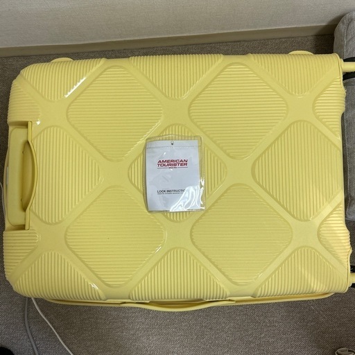 受け渡し決定　スーツケース　黄色
