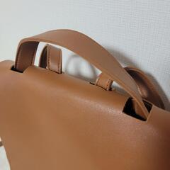 ブラウン　フェイクレザーリュックの画像