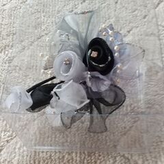 セレモニースーツとコサージュの画像