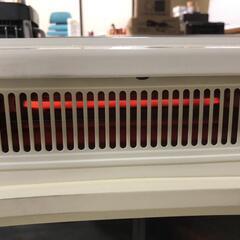 ね【松本市引き取り限定】薪ストーブ風・電気温風機の画像