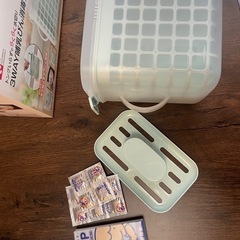 消毒ケース、ベビー服の画像