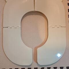 折りたためる子供用補助便座の画像
