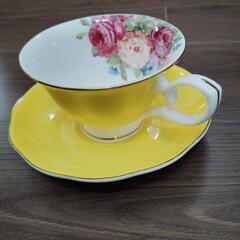 [商談中]黄色いティーカップの画像