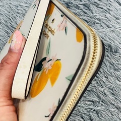 kate spade ルーシー オレンジ プリント リスレット 長財布 ポーチ ケイトスペード 財布 NewYorkの画像
