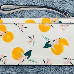 kate spade ルーシー オレンジ プリント リスレット 長財布 ポーチ ケイトスペード 財布 NewYorkの画像