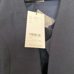 新品未使用 ノーカラー パンツスーツの画像