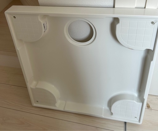 洗濯機の下敷き