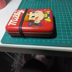 ペコちゃんブリキ缶の画像