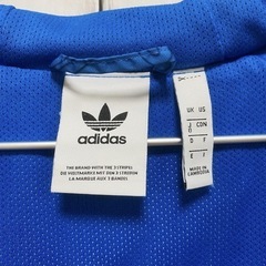 adidasオリジナルス総柄ナイロンジャケットの画像