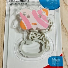 NUKのおしゃぶりとおしゃぶりホルダーのセットの画像