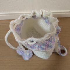 ポンポン付きニット帽と巾着リュックサックセットの画像