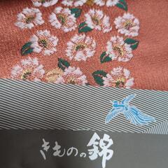 帯（オレンジ 花）の画像