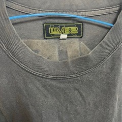 ブラックTシャツ ロゴ入り 使用感あり　蛍光の画像