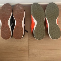 黒とオレンジのumbroサッカーシューズの画像