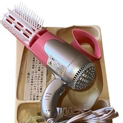 ピンク ハンドヘルド ヘアドライヤーの画像