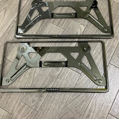 日産純正ナンバーフレーム未使用
の画像