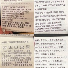 Nike ダウンジャケット L 黒と黄色のパターンの画像