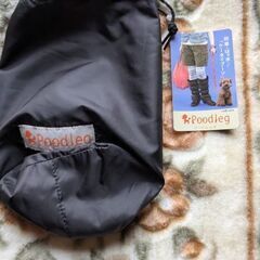 300円　未使用　黒リバーシブルレッグウォーマー　格納袋つきの画像