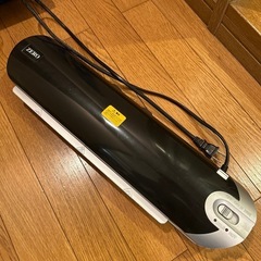 受け渡し調整中_ラミネーターとフィルム の画像