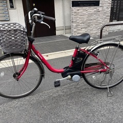 赤色のPanasonic製電動アシスト自転車