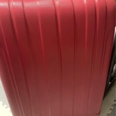 赤い26インチのスーツケース