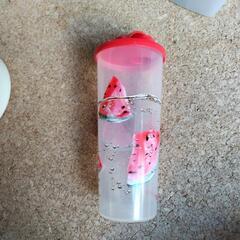 中古タッパー　タッパーウエア　緑の円形のもの外径約19.5cmの画像