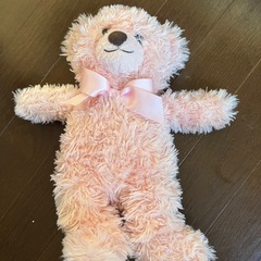 ピンクのくまぬいぐるみの画像