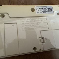 INAX イナックス　ウォシュレット　リモコンと取り付けプレート（ネジ付き）の画像