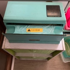 ラップ切り機