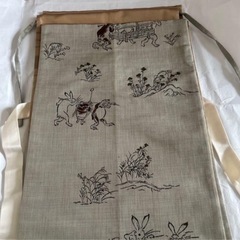 鳥獣戯画模様が描かれた洒落袋帯の画像