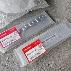 ホンダ ジョルノ AF70 用 純正新品 ライトリム、サイドエンブレム左右のセットの画像