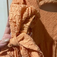 未使用品⭐︎オレンジの背中開きペプラムトップスの画像