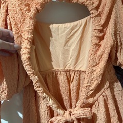 未使用品⭐︎オレンジの背中開きペプラムトップスの画像