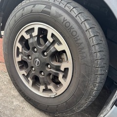 日産キャラバン プレミアムGXプロスタイルの純正アルミホイールタ...