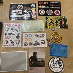 GLAYのCDやDVDについてきたステッカー（シール）、函館で昔購入したラッキーピエログッズ、ライブの銀テープなどの画像