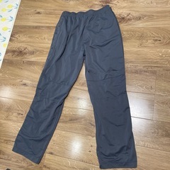 Nike グレー ジャージパンツ スナップボタン付きの画像