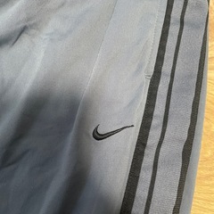 Nike グレー ジャージパンツ スナップボタン付きの画像