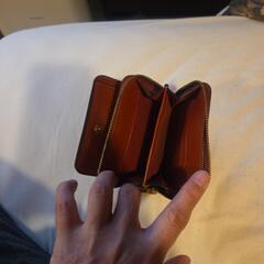 コ－チの二つ折の財布の画像